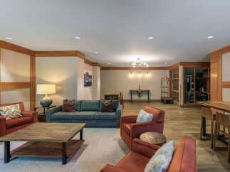 Experience comfort and style in this inviting living space, featuring plush seating arrangements perfect for relaxation.