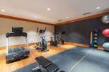 Equip your home gym with this comprehensive fitness setup, featuring a treadmill, elliptical, and stationary bikes for a complete cardio workout.