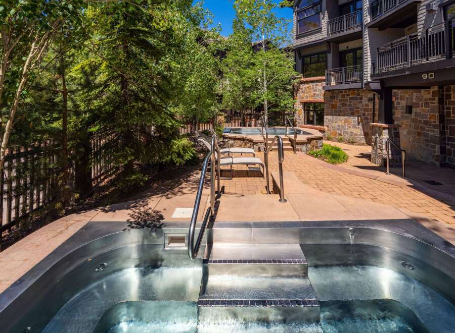Experience ultimate relaxation in this stunning outdoor oasis, featuring a luxurious stainless steel hot tub perfect for unwinding.