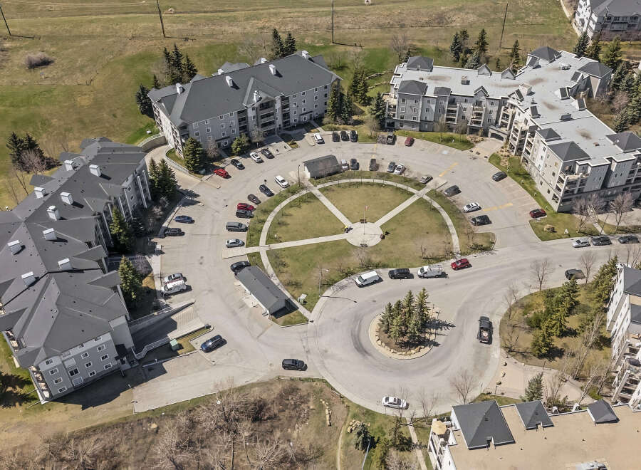 Discover modern living in this aerial view of a well-maintained apartment complex.