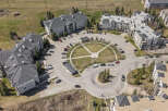 Discover modern living in this aerial view of a well-maintained apartment complex.