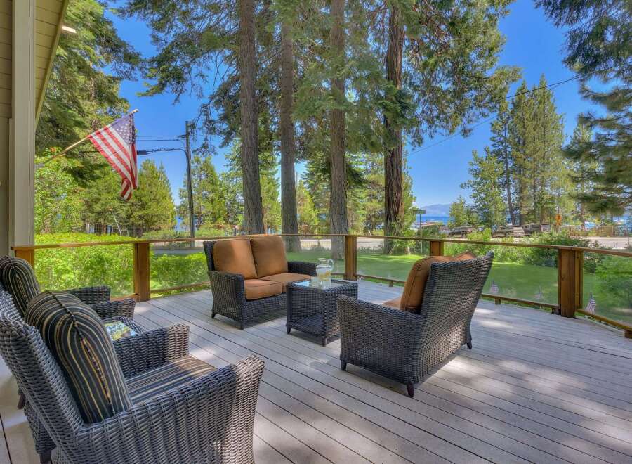 Enjoy breathtaking lake views from this expansive deck, perfect for entertaining or relaxing.