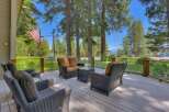 Enjoy breathtaking lake views from this expansive deck, perfect for entertaining or relaxing.