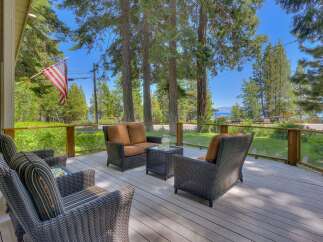 Enjoy breathtaking lake views from this expansive deck, perfect for entertaining or relaxing.