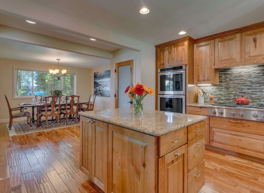 Experience elegant dining and gourmet cooking in this stunning kitchen and dining area.