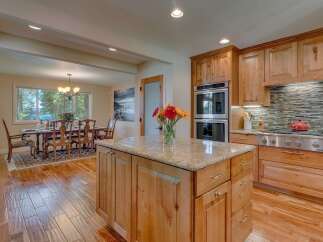 Experience elegant dining and gourmet cooking in this stunning kitchen and dining area.