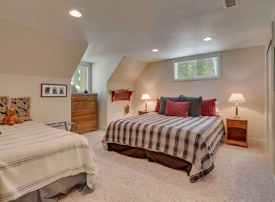 This charming bedroom features two comfortable beds, perfect for accommodating family or guests.