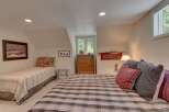 This charming bedroom features two beds, perfect for accommodating family or guests.