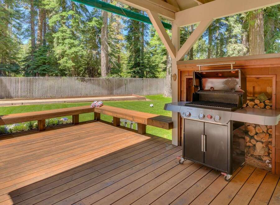Enjoy outdoor living with this spacious deck and built-in grill station, perfect for entertaining.
