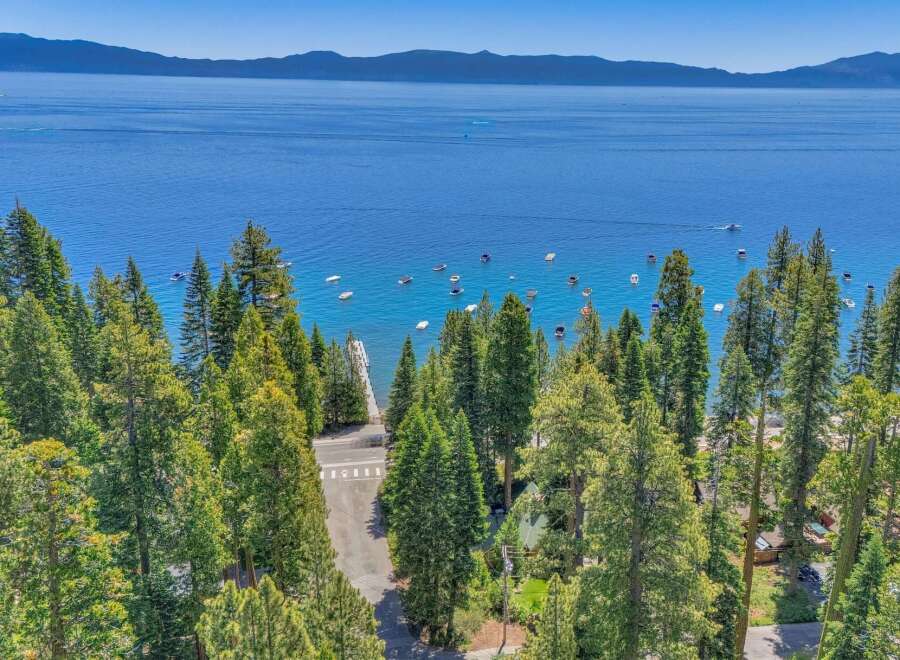 Experience the ultimate lakeside lifestyle with this stunning property offering breathtaking views of a crystal-clear lake and majestic mountains.