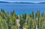 Experience the ultimate lakeside lifestyle with this stunning property offering breathtaking views of a crystal-clear lake and majestic mountains.