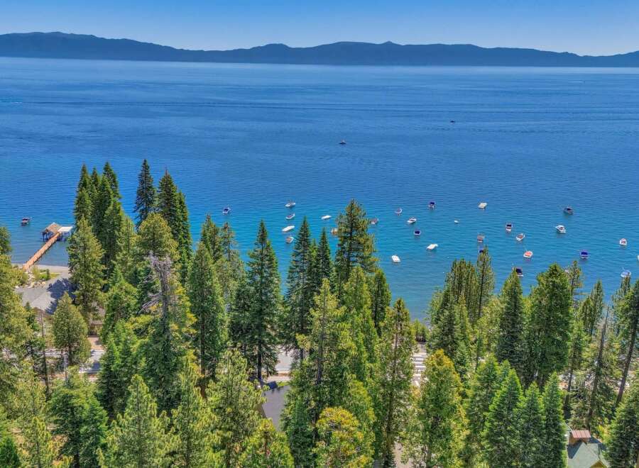 Experience the ultimate lakeside lifestyle with this stunning property offering panoramic views of the crystal-clear blue waters.