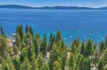 Experience the ultimate lakeside lifestyle with this stunning property offering panoramic views of the crystal-clear blue waters.