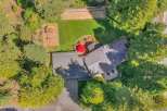 Discover this stunning property featuring a spacious backyard with a dedicated playground and a bocce ball court, perfect for outdoor recreation and family fun.