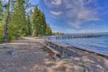 Enjoy lakeside living with this stunning property featuring a private dock perfect for boating and water activities.