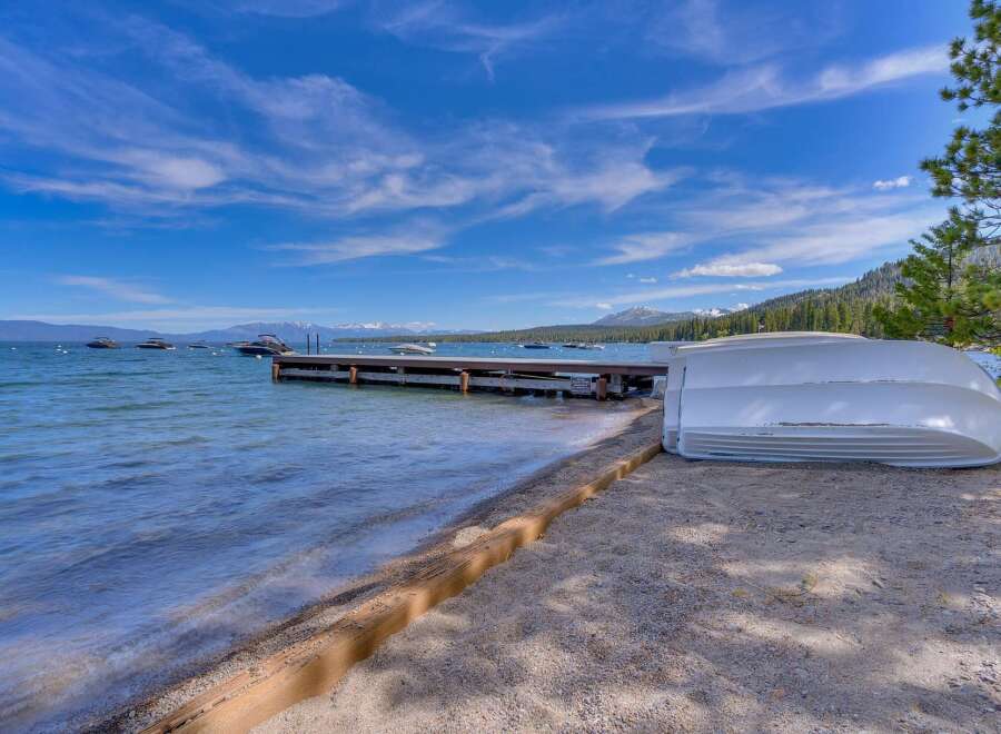 Enjoy lakeside living with this stunning property featuring a private dock perfect for your boats.