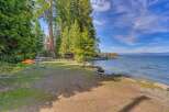 Enjoy serene lakefront living with this stunning property, featuring a private dock and boathouse perfect for water enthusiasts.