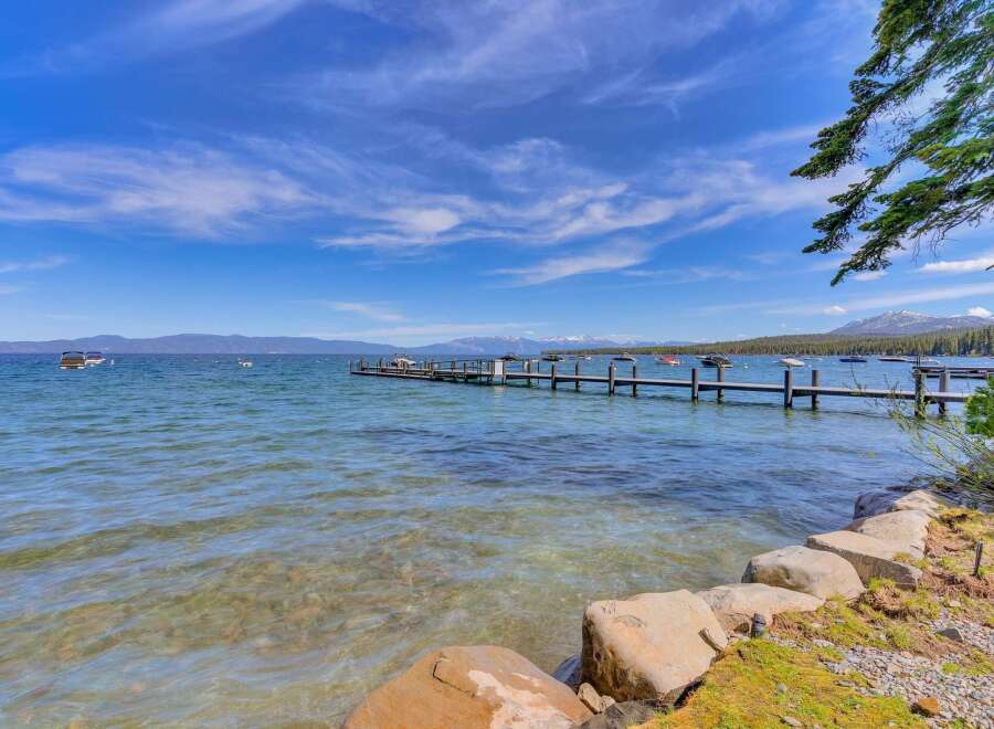 Experience lakeside living with this stunning property featuring a private dock perfect for your boats and water toys.