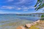 Experience lakeside living with this stunning property featuring a private dock perfect for your boats and water toys.