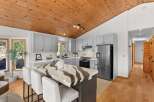 Experience the charm of this beautifully updated kitchen, featuring a striking island with a unique stone countertop and comfortable bar seating.