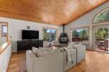 Experience cozy living in this mountain retreat, featuring a stunning stone fireplace as the centerpiece of the living room.