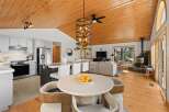 Experience modern living in this open-concept home featuring a gourmet kitchen with stainless steel appliances and a spacious island, perfect for entertaining.