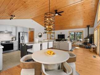 Experience modern living in this open-concept home featuring a gourmet kitchen with stainless steel appliances and a spacious island, perfect for entertaining.