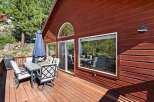 Enjoy outdoor living on this spacious wooden deck, perfect for entertaining or relaxing.