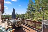 Enjoy breathtaking mountain views from this spacious deck, perfect for outdoor dining and entertaining.