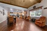 Experience rustic charm in this spacious open-concept kitchen and dining area, perfect for gatherings.