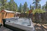 Relax and unwind in this luxurious hot tub, perfect for enjoying the serene mountain surroundings.