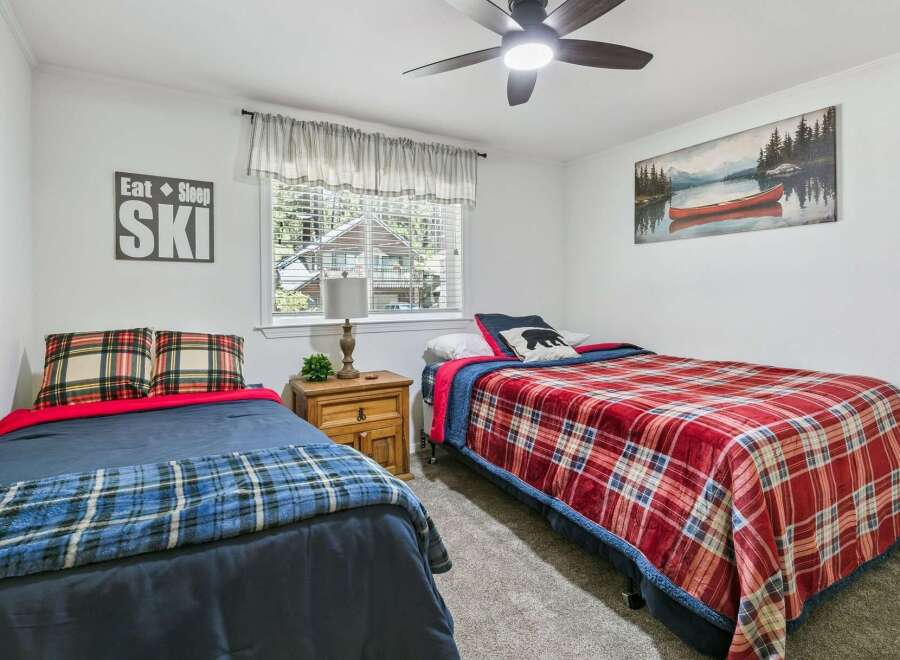 This charming bedroom features two comfortable twin beds, perfect for accommodating guests or family.