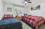 This charming bedroom features two comfortable twin beds, perfect for accommodating guests or family.