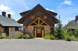 Experience rustic charm in this mountain-style home featuring a stone and wood exterior.