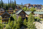 Experience luxury mountain living in this stunning ski-in/ski-out property, featuring a collection of exquisite chalets and condominiums nestled amidst towering evergreen trees.
