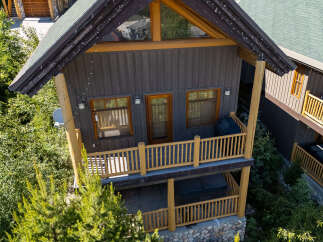 Experience the ultimate mountain retreat in this charming log cabin, featuring a spacious deck with a grill and a relaxing hot tub on the lower level.