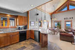 Experience breathtaking mountain and lake views from this stunning open-concept living space.
