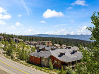 Discover mountain living at its finest with these stunning properties nestled amidst a lush evergreen forest.