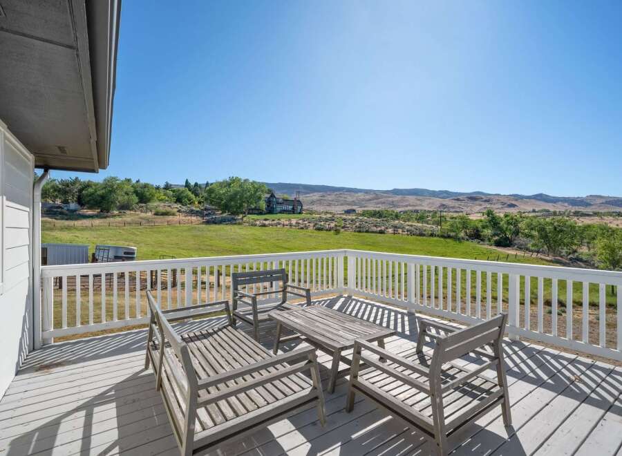 Enjoy breathtaking panoramic views from this expansive deck, perfect for outdoor entertaining or quiet relaxation.
