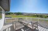 Enjoy breathtaking panoramic views from this expansive deck, perfect for outdoor entertaining or quiet relaxation.