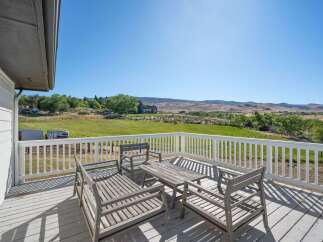 Enjoy breathtaking panoramic views from this expansive deck, perfect for outdoor entertaining or quiet relaxation.