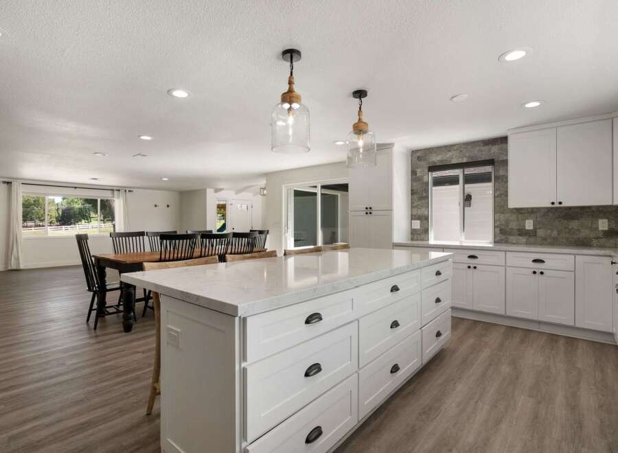 Experience spacious open-concept living in this beautifully renovated kitchen and dining area.