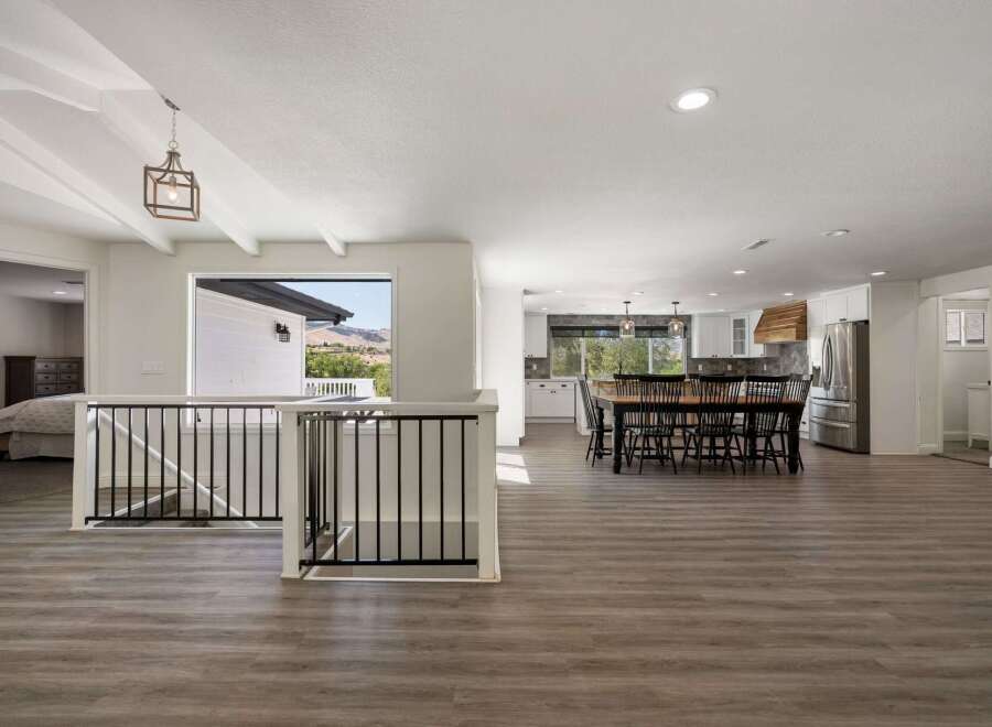 Experience modern living in this spacious open-concept home featuring a stunning kitchen with ample cabinetry and a large island perfect for entertaining.