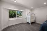 This charming nursery features a cozy white crib with a canopy, perfect for a little one's dreams.
