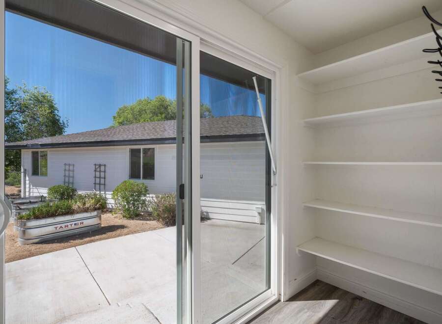 Step outside into your private backyard oasis, perfect for gardening enthusiasts.