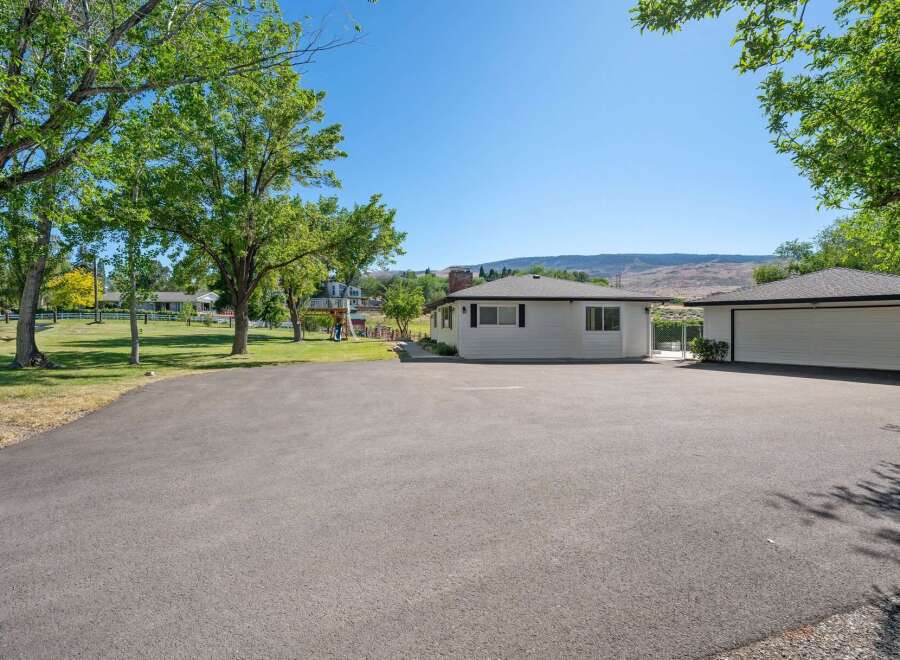 Discover this charming property featuring a well-maintained single-story home with a detached garage, perfect for car enthusiasts or extra storage.