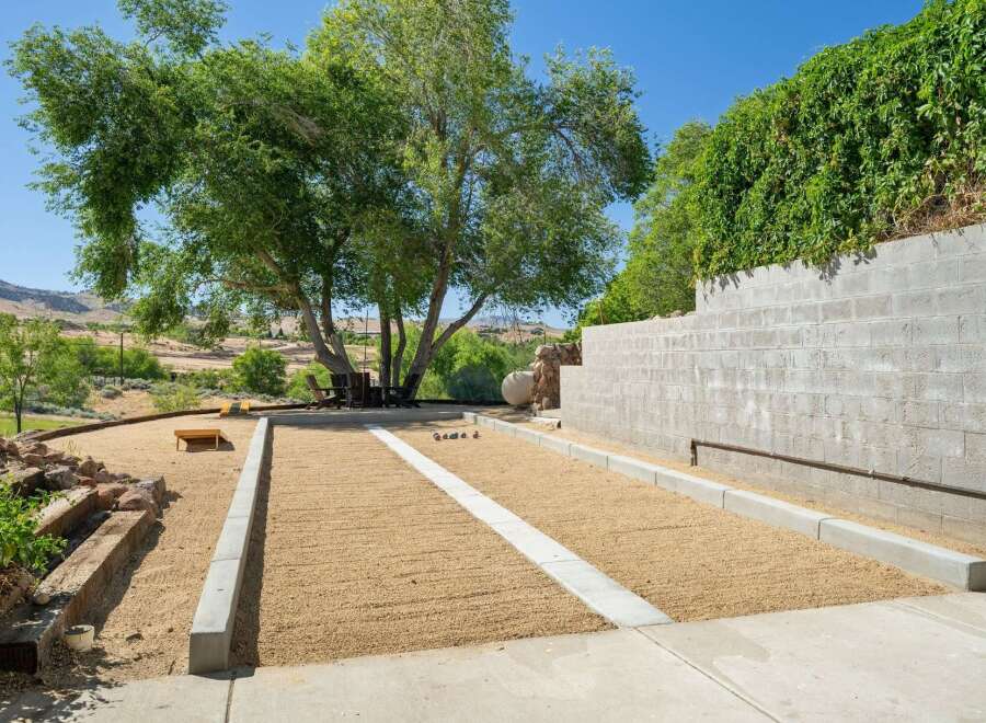Enjoy outdoor recreation with this dedicated bocce ball court, perfect for friendly competition.