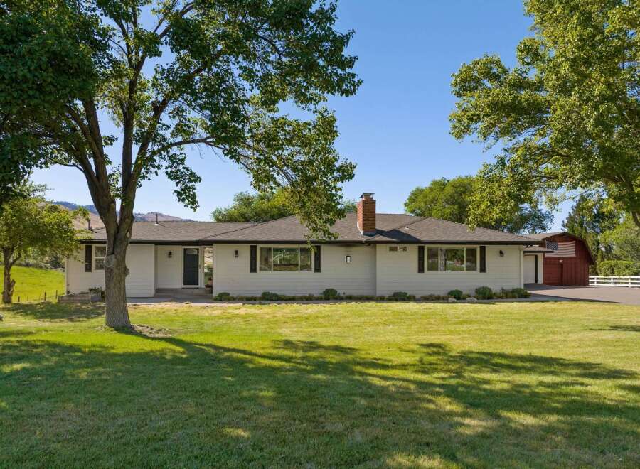 Discover this charming single-story home nestled on a sprawling property, offering a perfect blend of comfort and outdoor living.