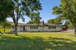 Discover this charming single-story home nestled on a sprawling property, offering a perfect blend of comfort and outdoor living.