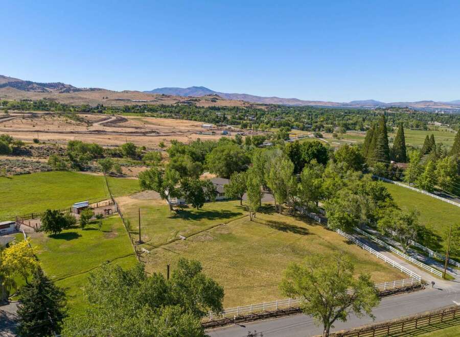 Discover this expansive property offering a serene rural lifestyle with breathtaking mountain views.